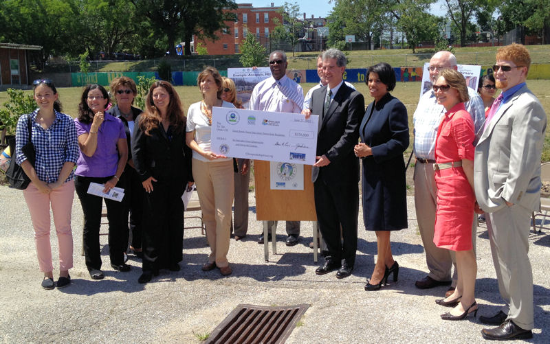 Representatives of organizations receiving grants through the 2012 Green Streets–Green Jobs–Green Towns Initiative attend a press conference. The Water Environment representative is Tim Williams, senior director of Government Affairs (fourth from left). Photo courtesy of Williams.