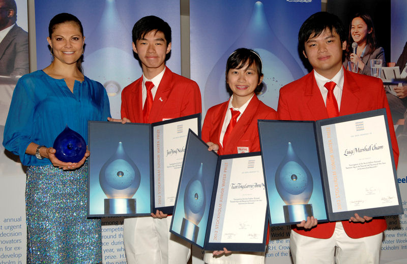 From left, Crown Princess Victoria of Sweden stands with the 2012 Stockholm Junior Water Prize winning team Jun Yong Nicholas Lim, Tian Ting Carrie-Anne Ng, and Luigi Marshall Cham. Photo courtesy of Cecilia Österberg, Exray and the Stockholm International Water Institute.