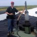 Matt Reis, chief technical officer at the Water Environment Federation (Alexandria, Va.), stands next to a gas extratction device on top of the Polk County (Fla.) bioreactor landfill. Photo courtesy of Reis.