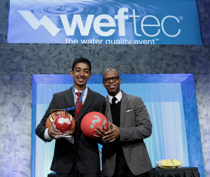 Jain stands with the WEFTEC 2013 Opening General Session speaker, Kevin Carroll.  Photo courtesy of Oscar Einzig photography.
