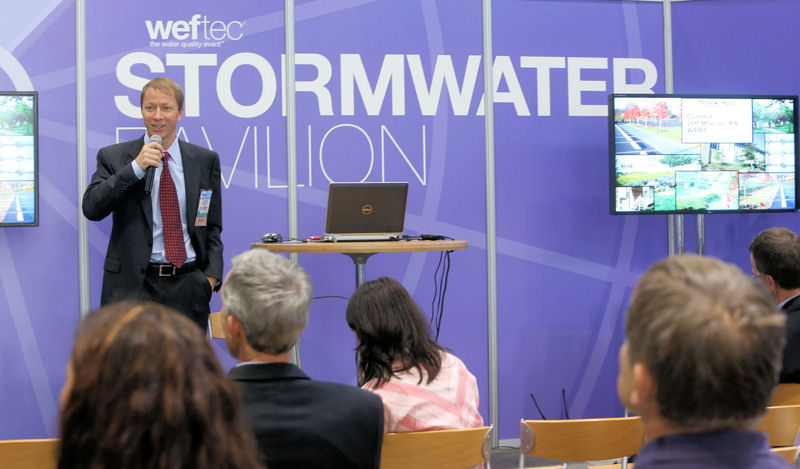 A speaker presents information in the Stormwater Pavilion during WEFTEC® 2013. Photo courtesy of Oscar Einzig photography.
