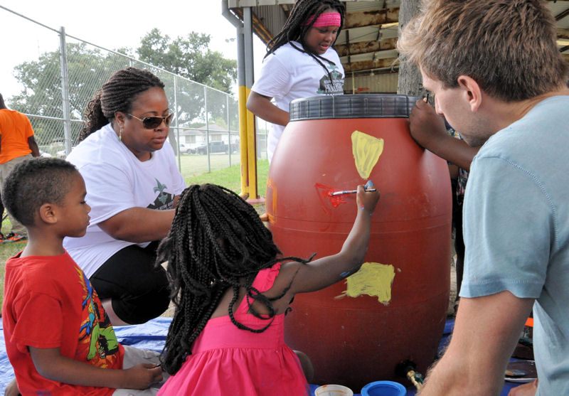 Activity stations engaged the local community in stormwater-related educational activities such as painting rain barrels. Photo courtesy of the Sewerage and Water Board of New Orleans.