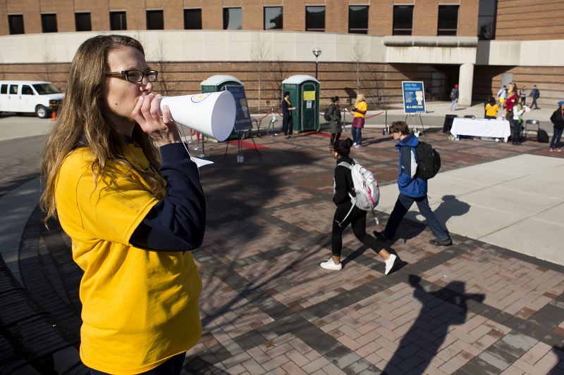 On April 1, Jennifer Judge Hensel, assistant director at the College of Engineering communications and marketing office, helps round up donors at an event to gather urine for research. Photo by Joseph Xu from the university college of engineering office of communications and marketing.