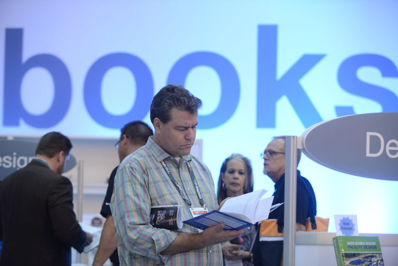 A WEFTEC 2014 attendee shops in the WEF bookstore. Photo courtesy of Oscar Einzig photography.