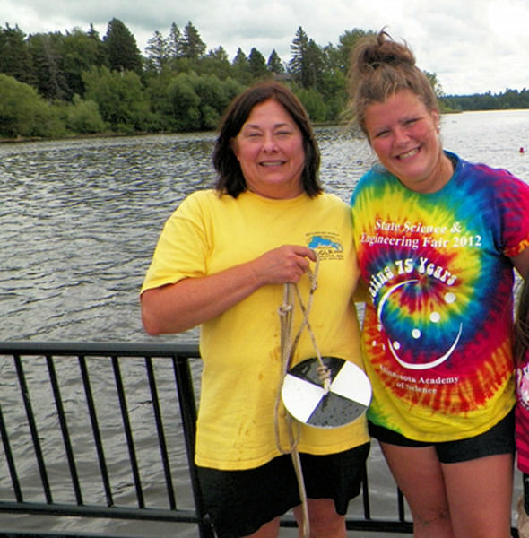 Cynthia Welsh and Madison Pallin sample water quality on the the St. Louis River Estuary and Lake Superior. Pallin, currently majoring in Environmental Science at the University of Minnesota, Duluth, hopes to become a marine biologist like her brother Logan Pallin, Welsh said. Photo courtesy of Welsh. 