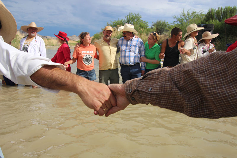 The Water/Ways exhibit showcases the relationship between people and water through images from events such as the 2014 Voices from Both Sides event where Americans and Mexicans gathered, joining hands across the Rio Grande. Photo courtesy of Lorne Matalon, Smithsonian.