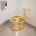 “America,” a solid gold sculpture now on display at the Guggenheim Museum in New York City, must be cleaned every 15 minutes using special wipes. Janitorial staff also steam clean the toilet periodically. Photo courtesy of Kris McKay/Solomon R. Guggenheim Foundation.