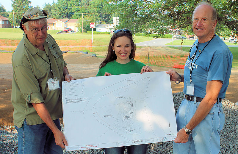 WEF staff member Caroline Pakenham (center) holds the plans for the rain garden with WEF members Jim Condon (left) and Carl Jason (right). Photo courtesy of David Stewart, director of the Piney Creek Watershed Association (Beckley, W.Va.).
