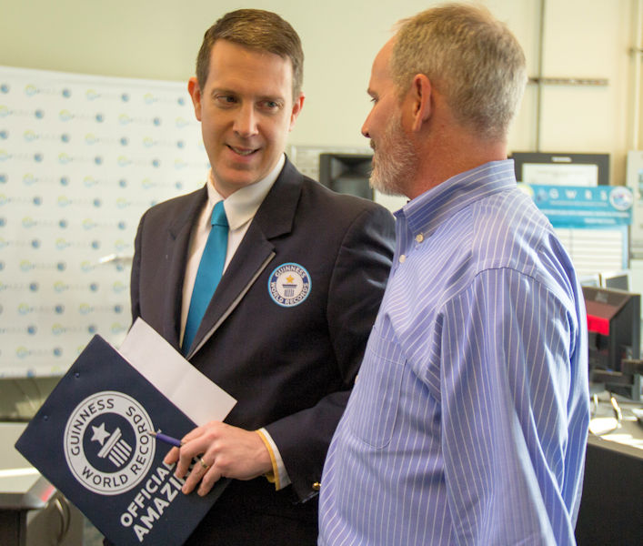 From left, Philip Robertson, Guinness World Record® adjudicator, talks to Denis Bilodeau, OCWD president, on the day that OCWD and OCSD received a certificate commemorating the setting of the Guinness World Record for “most wastewater recycled to drinking water in 24 hours.” Photo courtesy of OCWD.