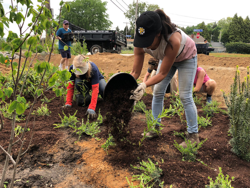 NEWEA members and the community came together to install green infrastructure as part of the project. Photo courtesy of Cheng.